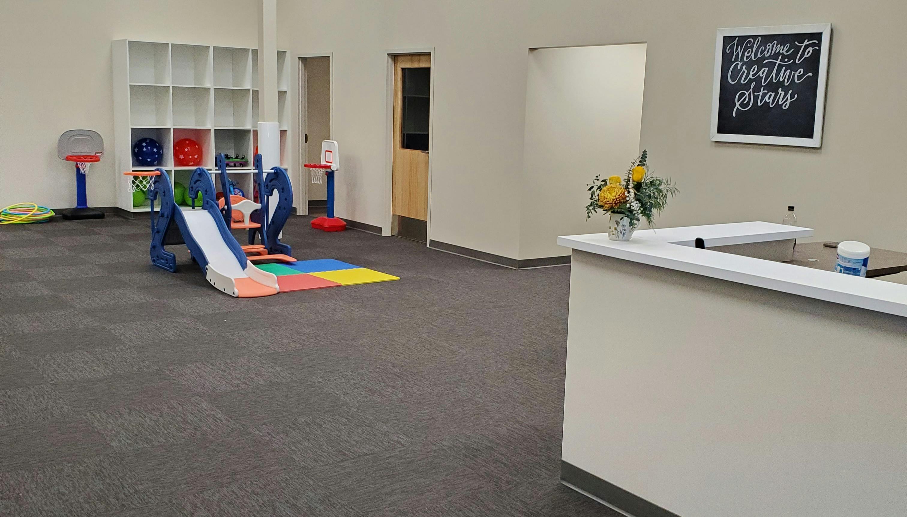 Indoor play area with slide and reception desk