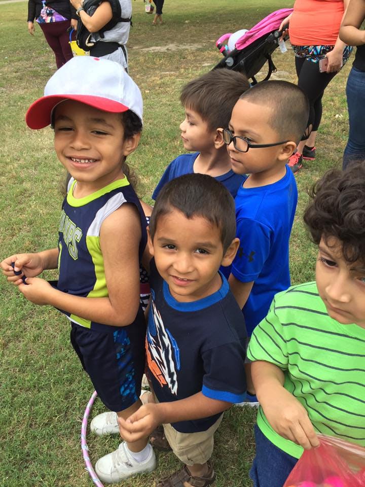 Group of children standing on grass