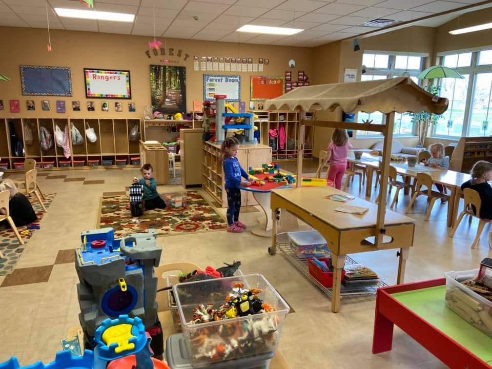 Children playing with toys in a classroom