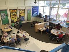 People and children in a classroom