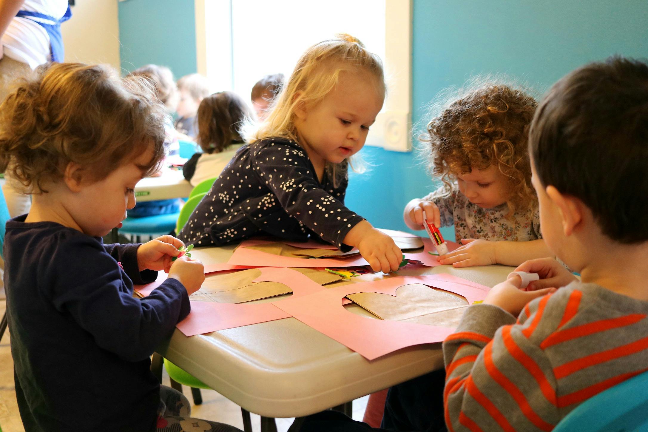 Children doing crafts at a table