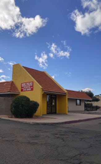 Yellow building with a red roof and a sign that reads "Baby Palace"