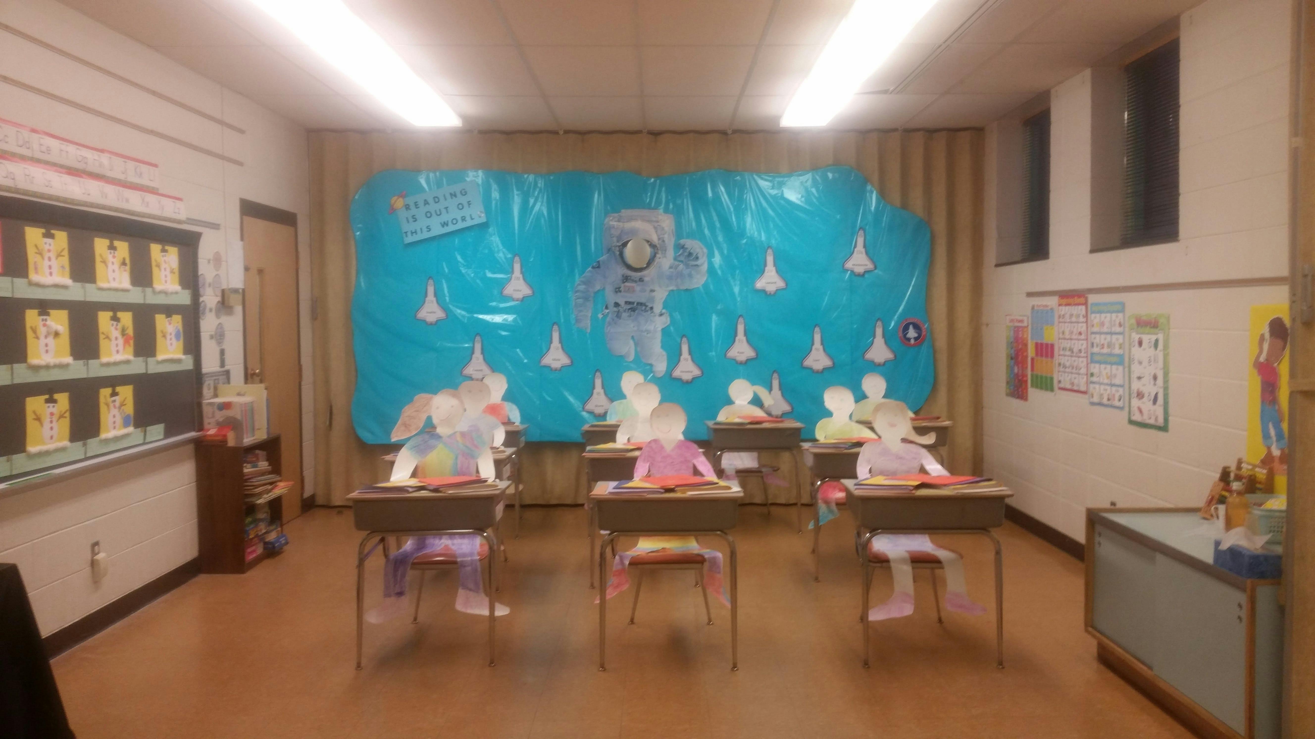 Classroom with desks and space-themed decorations