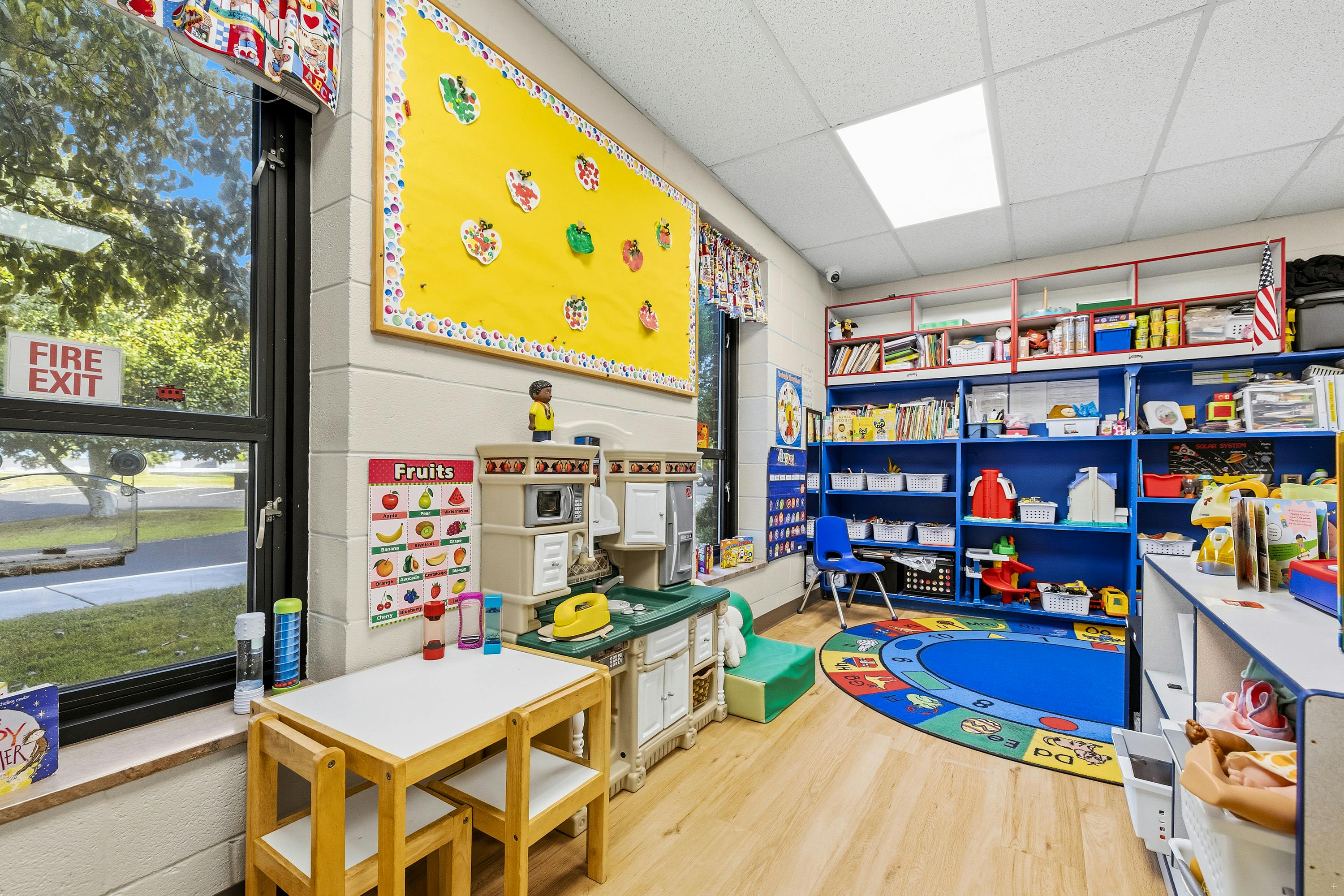 Play area in a preschool classroom with toys and learning materials
