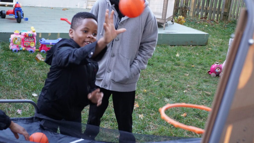 Child playing with a ball outdoors