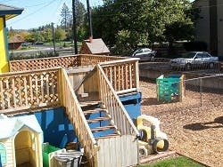 Wooden deck and stairs in a playground area