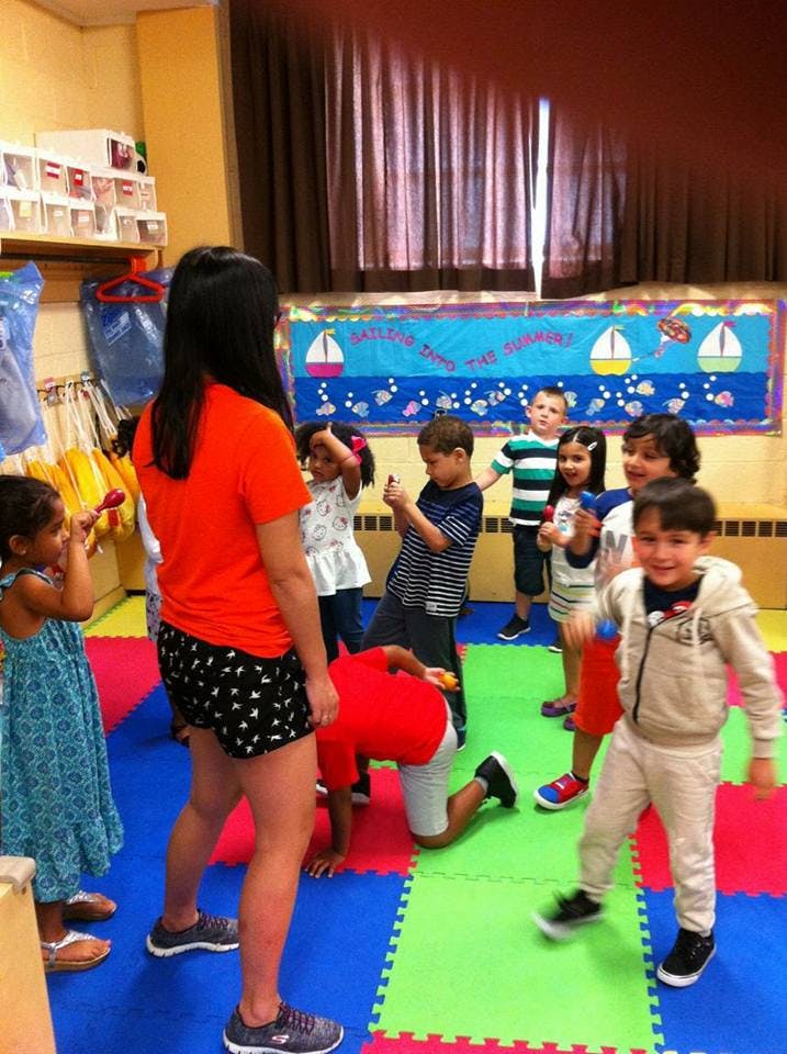 Adult and children in a classroom