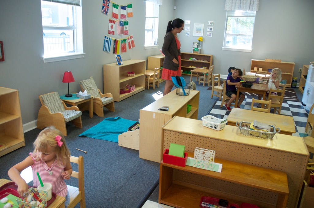 Adult and children in a classroom