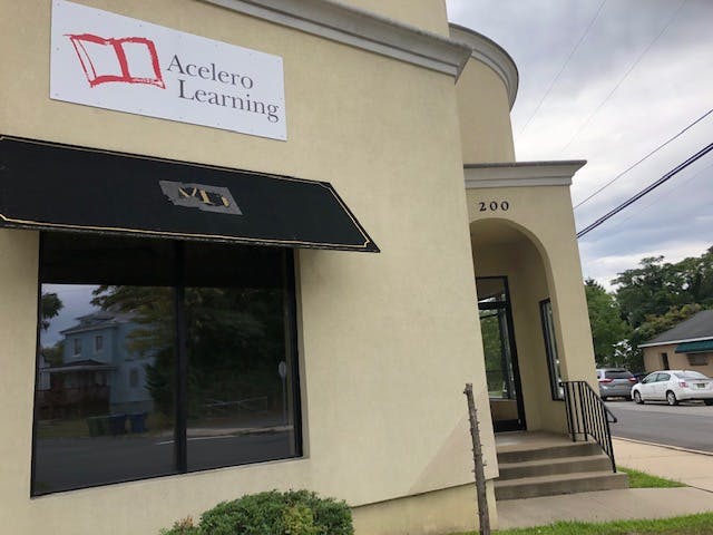 Exterior of a building with a sign that reads Acelero Learning