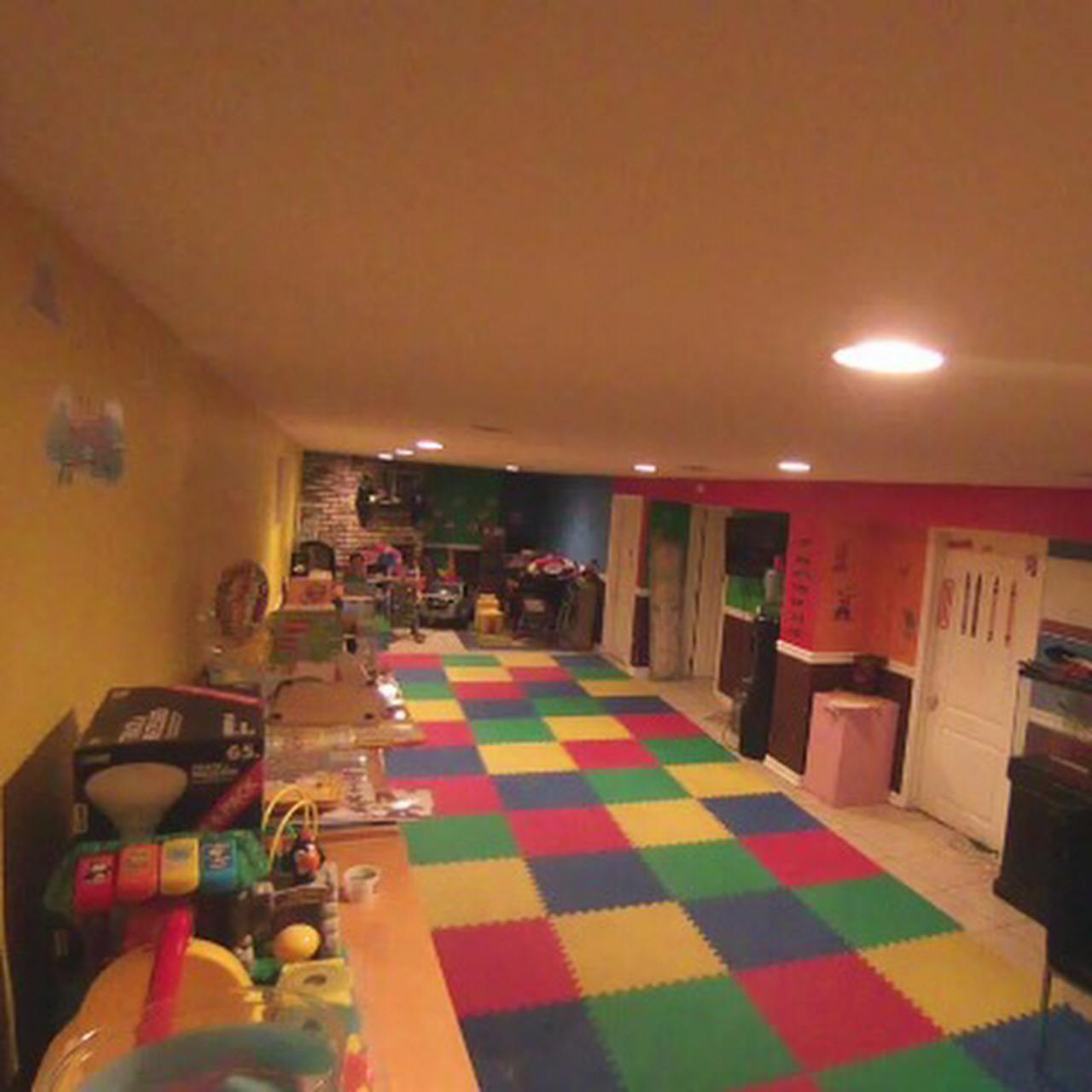 Playroom with colorful checkered floor tiles and toys