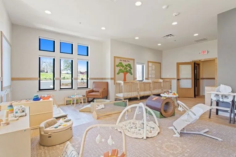 Playroom with various infant and toddler play equipment