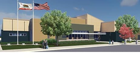 Building exterior with flags and trees