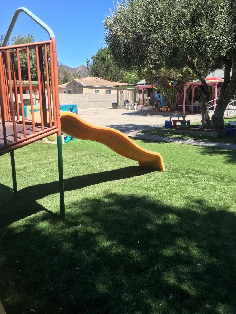 Playground slide on green grass