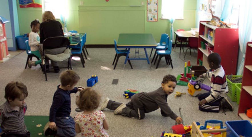 Children playing with toys in a classroom