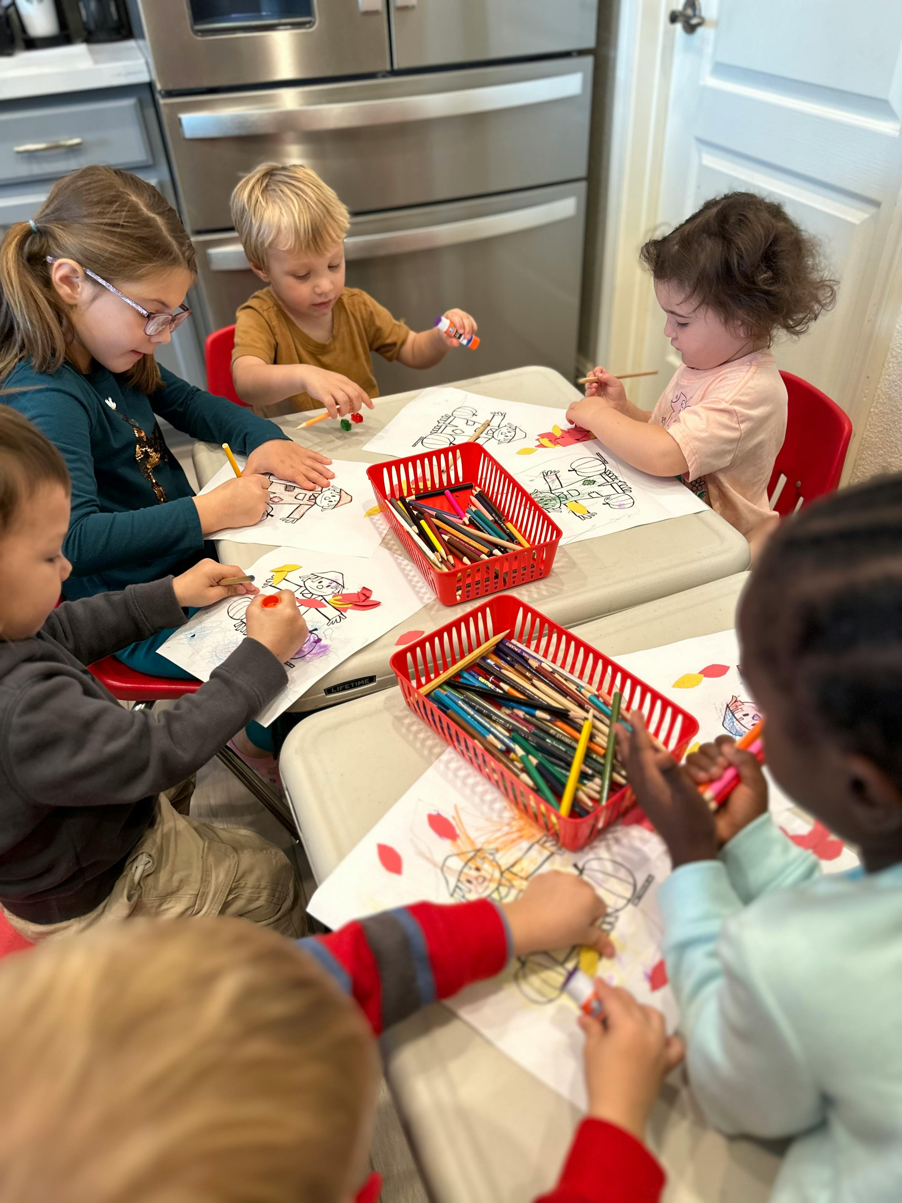 Children coloring at a table