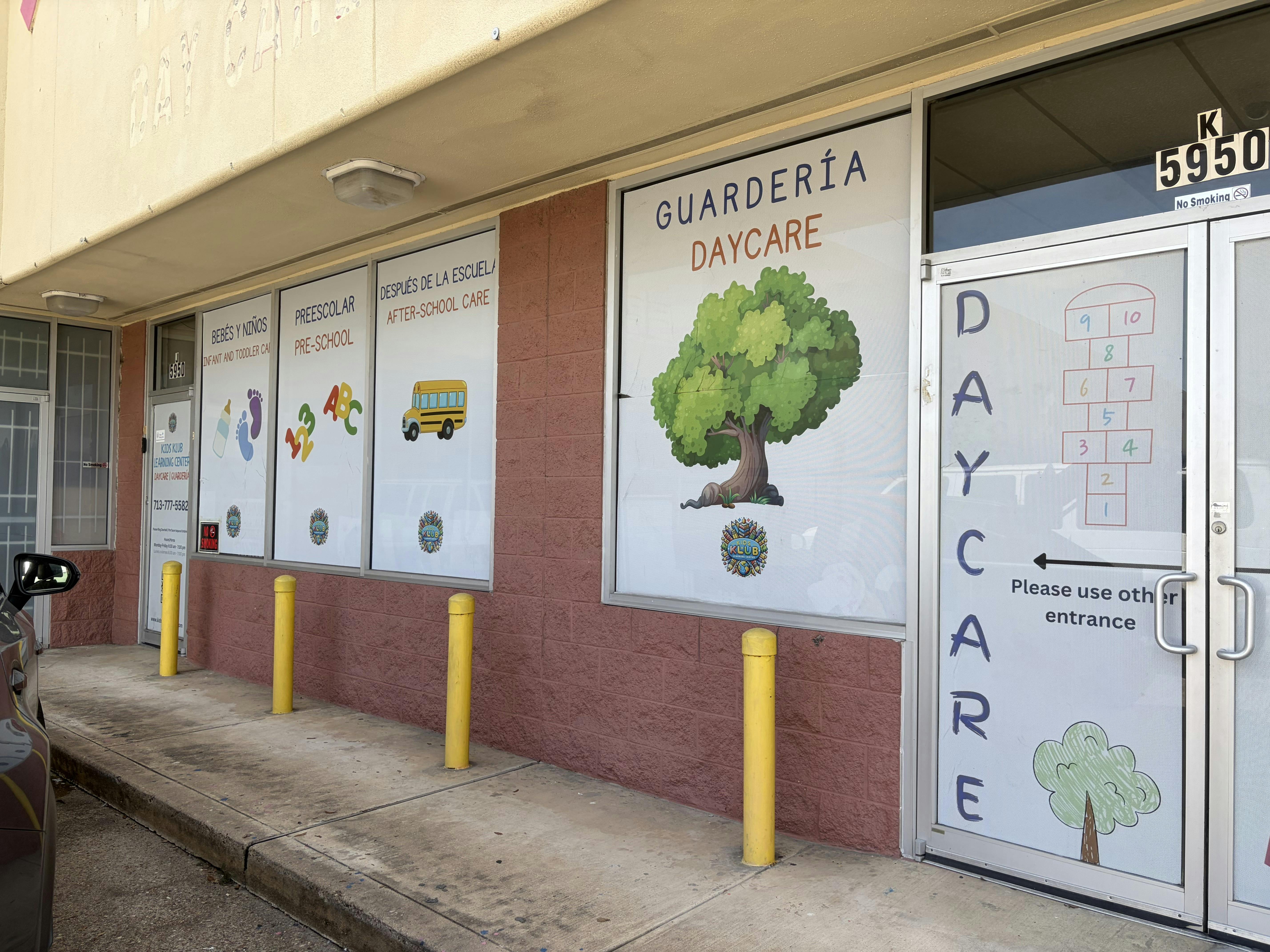 Exterior facade of a daycare center with window decals showing services