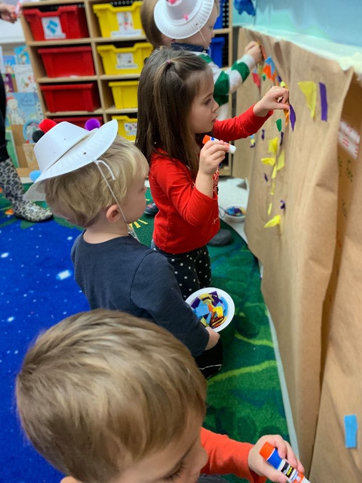 Children doing an art project in a classroom