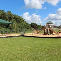 Playground with slides, swings, and climbing structures