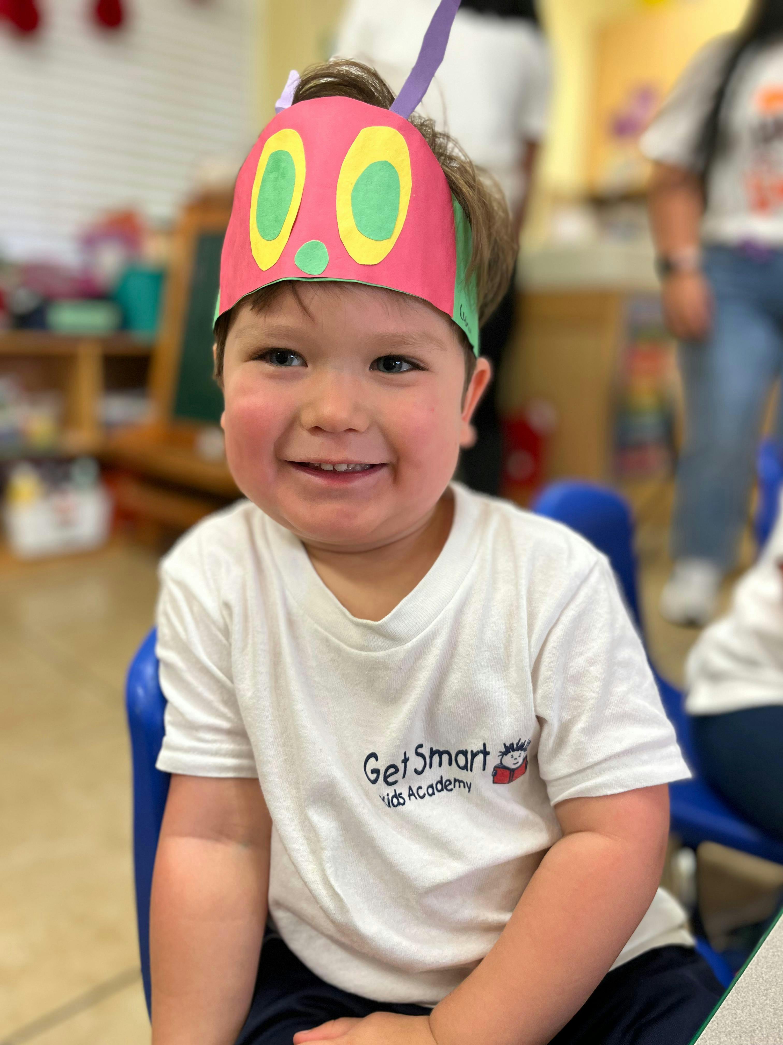 Child wearing a caterpillar hat