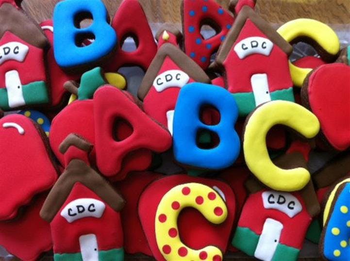 Cookies shaped like letters and houses