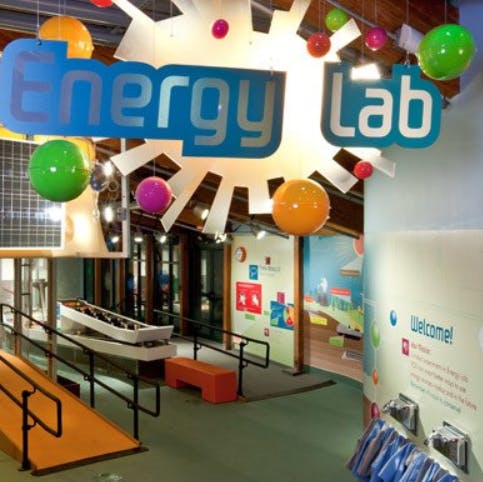 Energy Lab sign with colorful spheres and ramps in an exhibit space