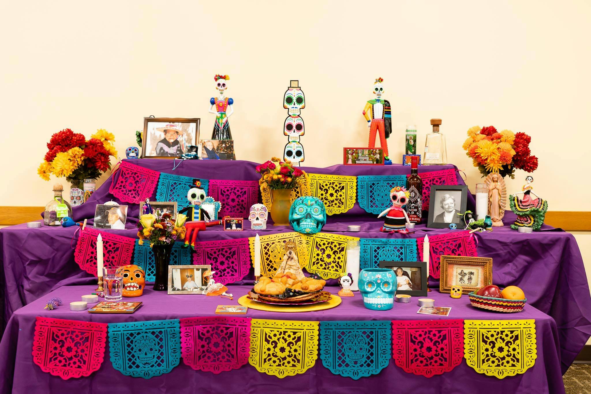 Day of the Dead altar with colorful decorations and offerings