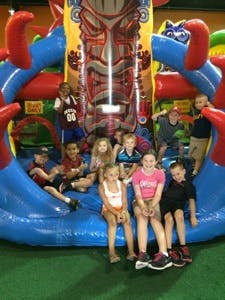 Children playing on an inflatable bounce house