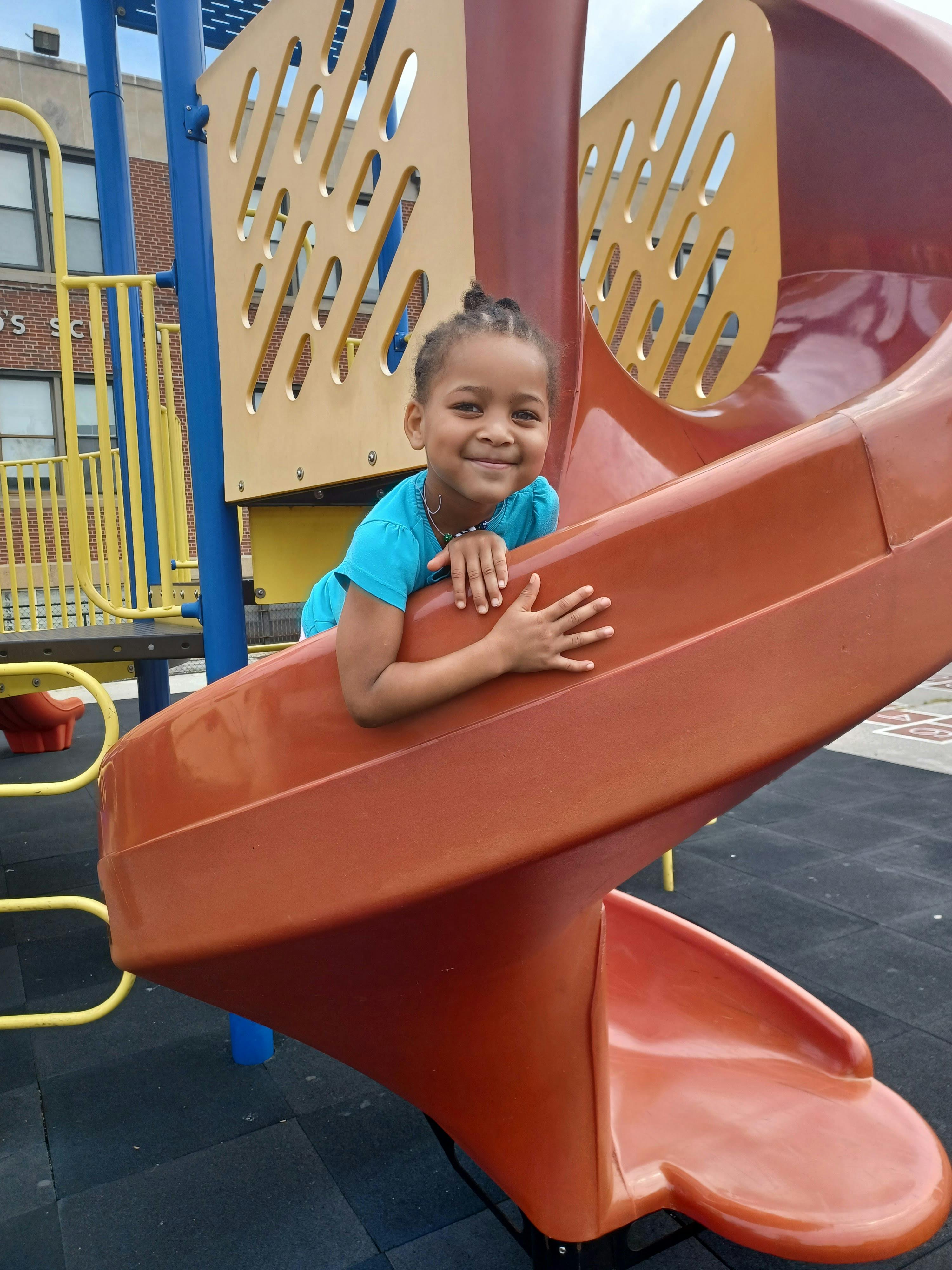 Child on a playground slide