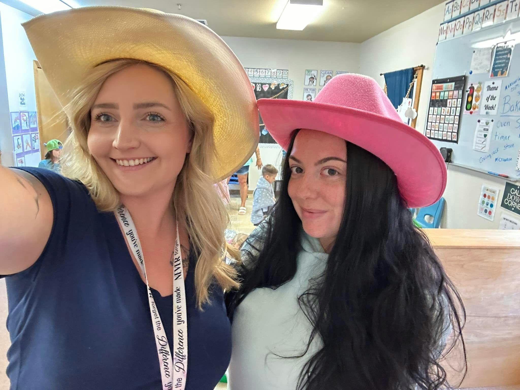 Two people wearing cowboy hats