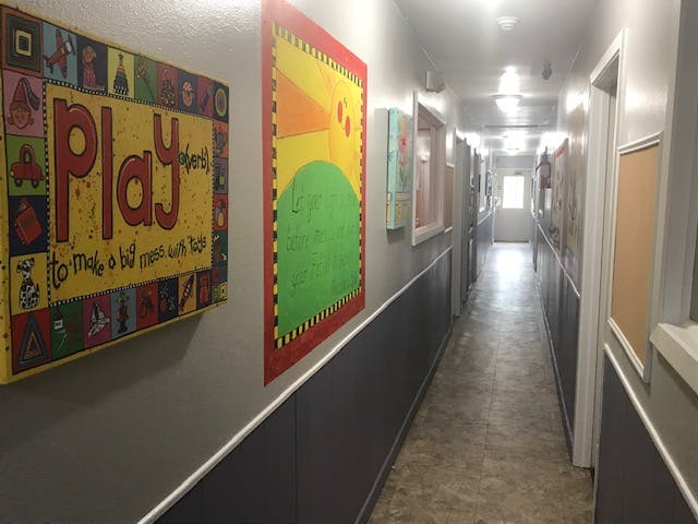 Hallway with colorful artwork on the walls