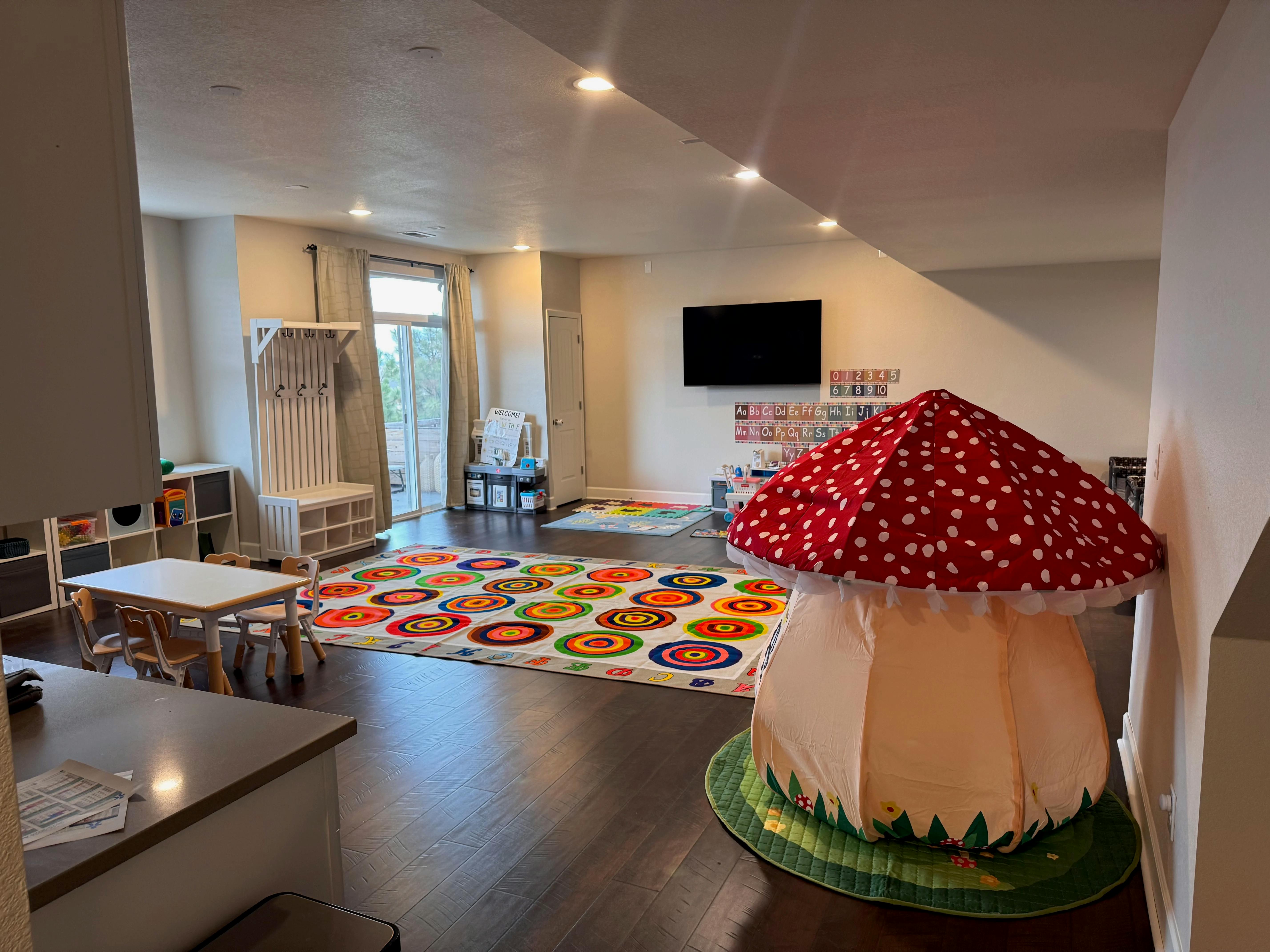 Playroom with mushroom tent and colorful rug