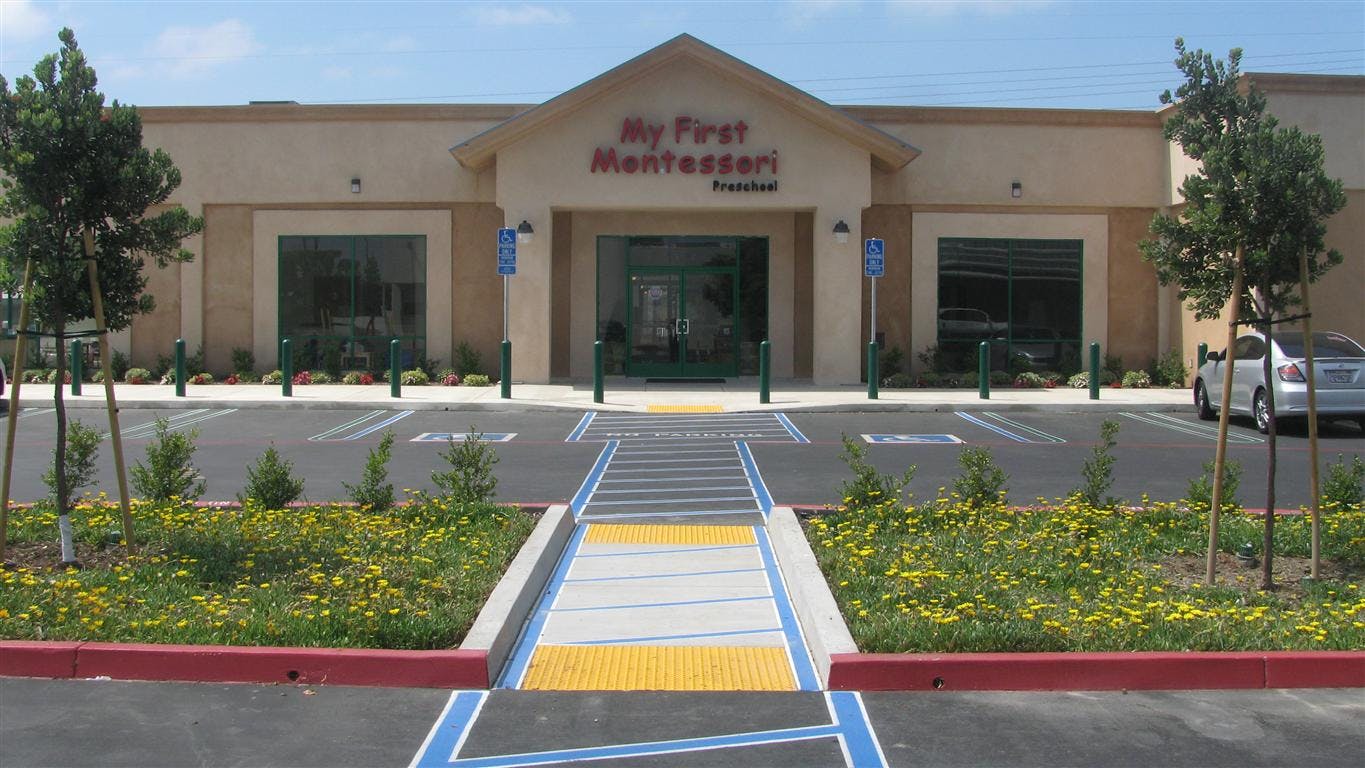 Building with "My First Montessori" sign and parking lot