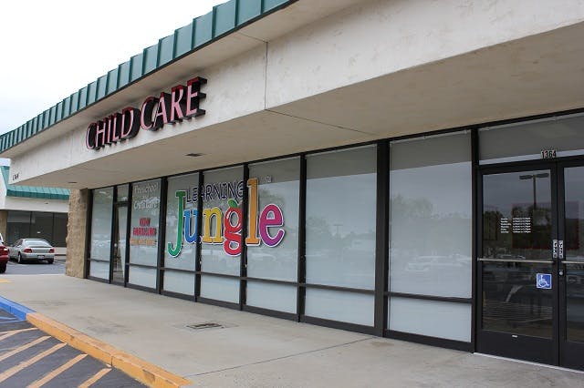 Child Care building with "Jungle" sign on windows