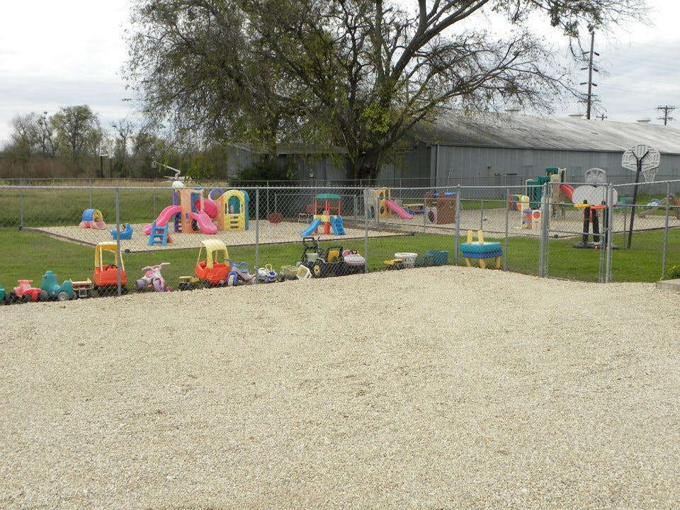 Outdoor playground with slides and ride-on toys
