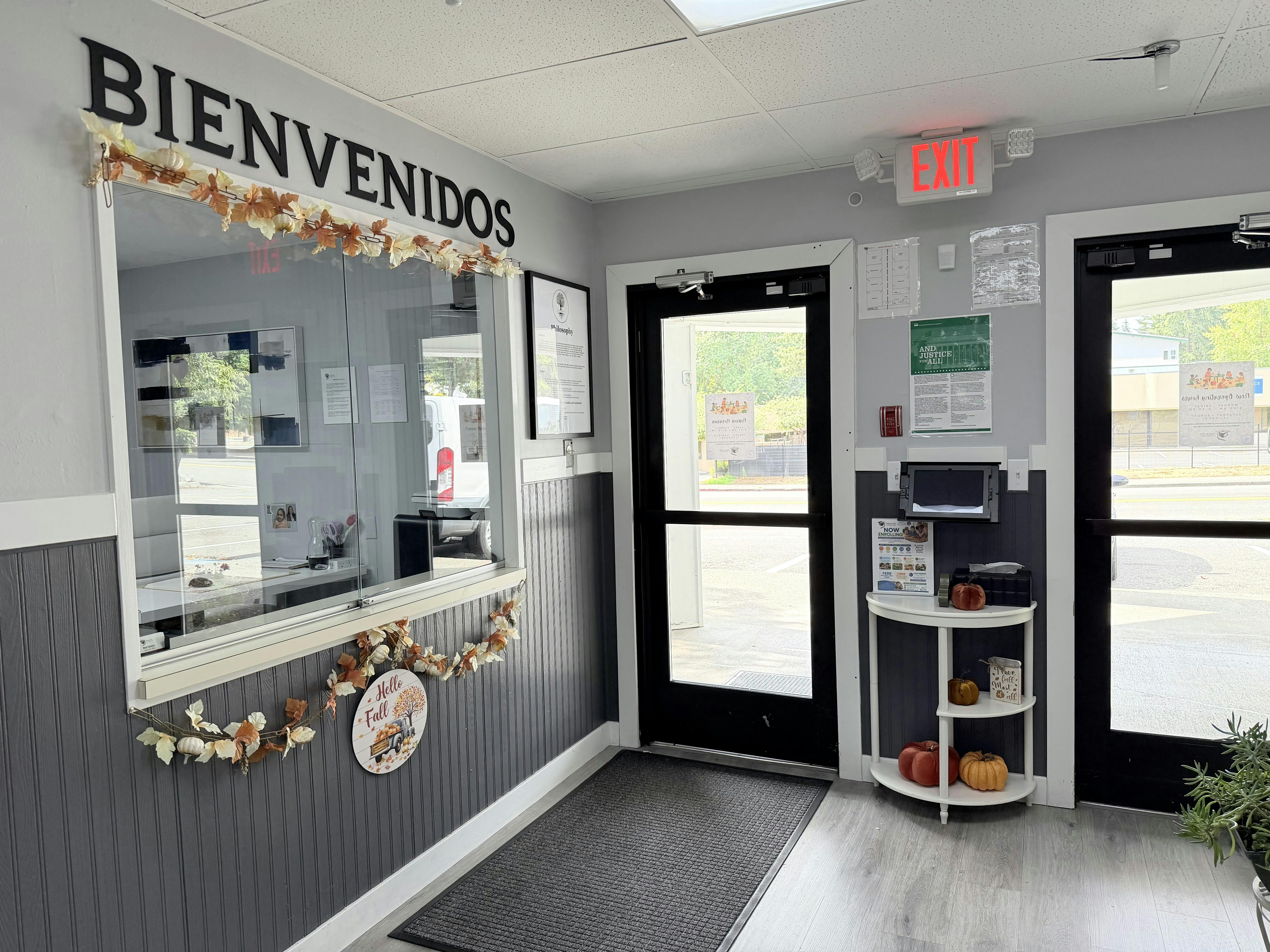 Reception area with Bienvenidos sign and fall decorations