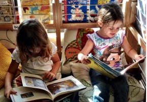 Two children reading books