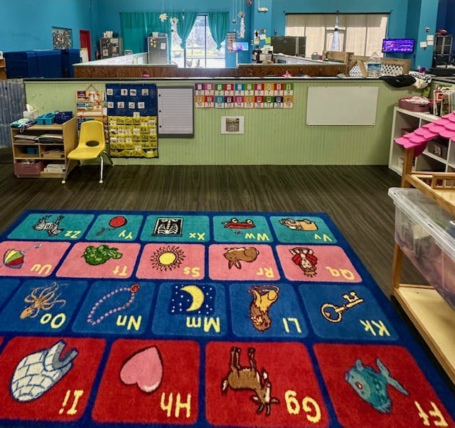 Classroom with an alphabet rug on the floor