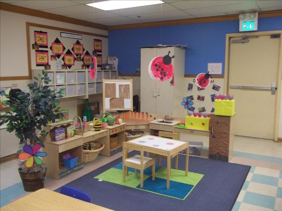 A colorful classroom with child-sized furniture and decorations