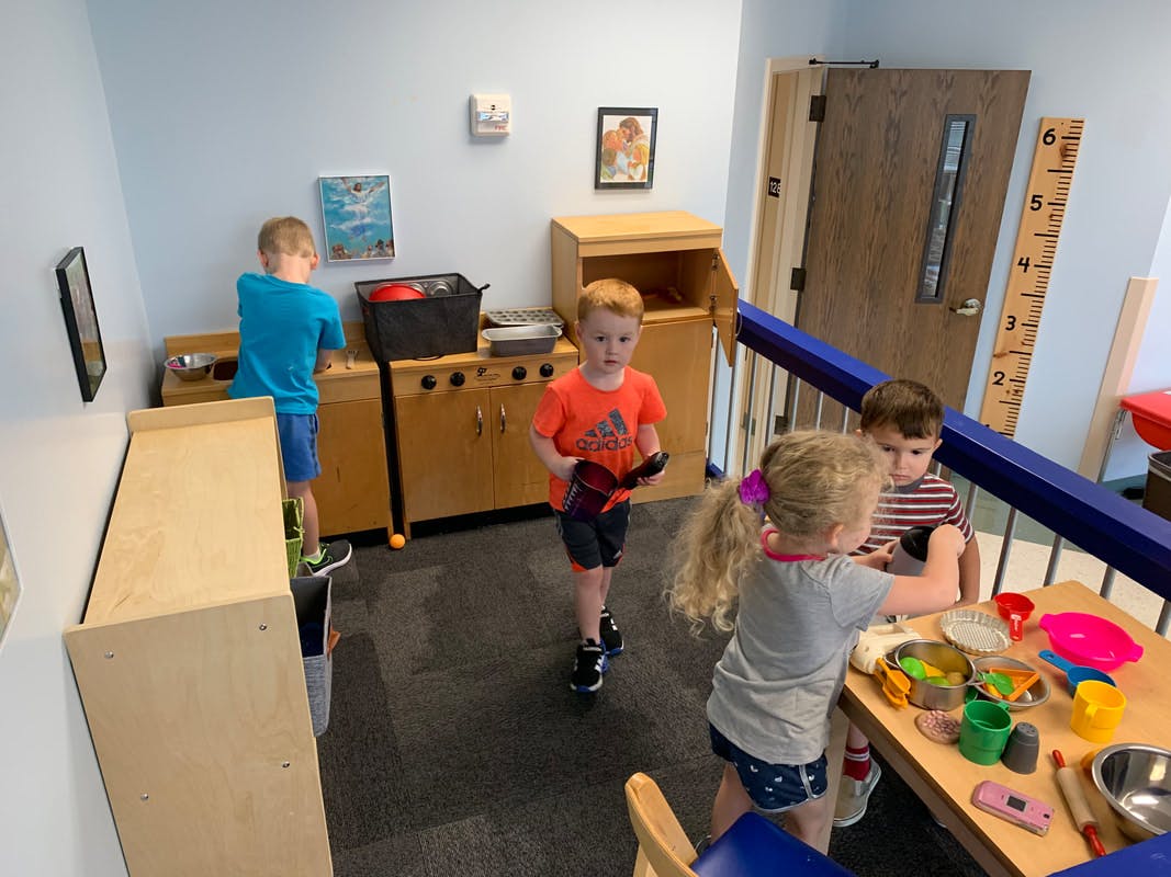 Children playing in a classroom