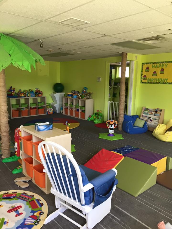 Playroom with toys, shelves, and soft play equipment