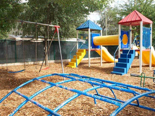 Playground with swings, slides, and climbing dome
