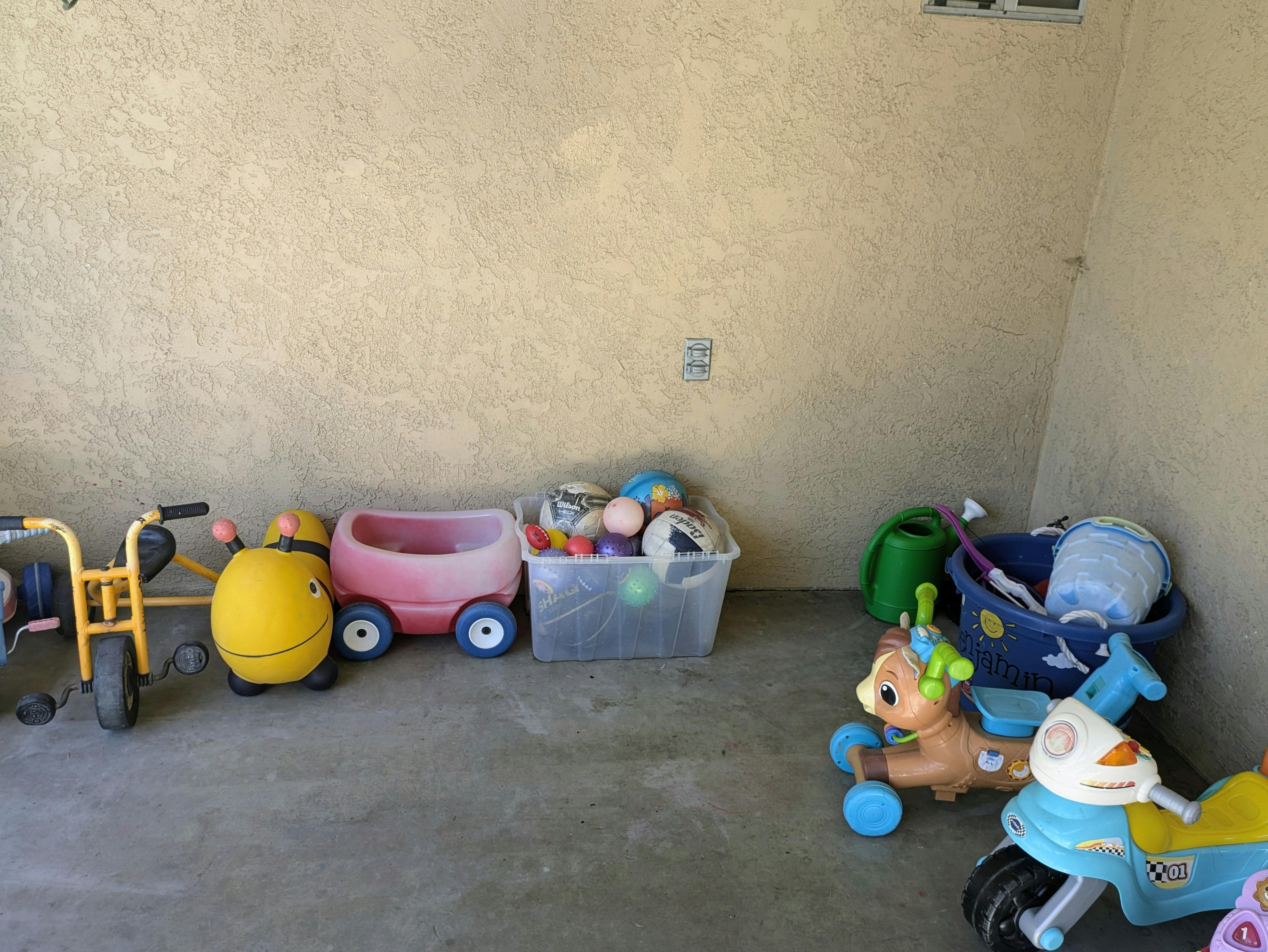 Children's toys including tricycles, wagons, and ride-on toys