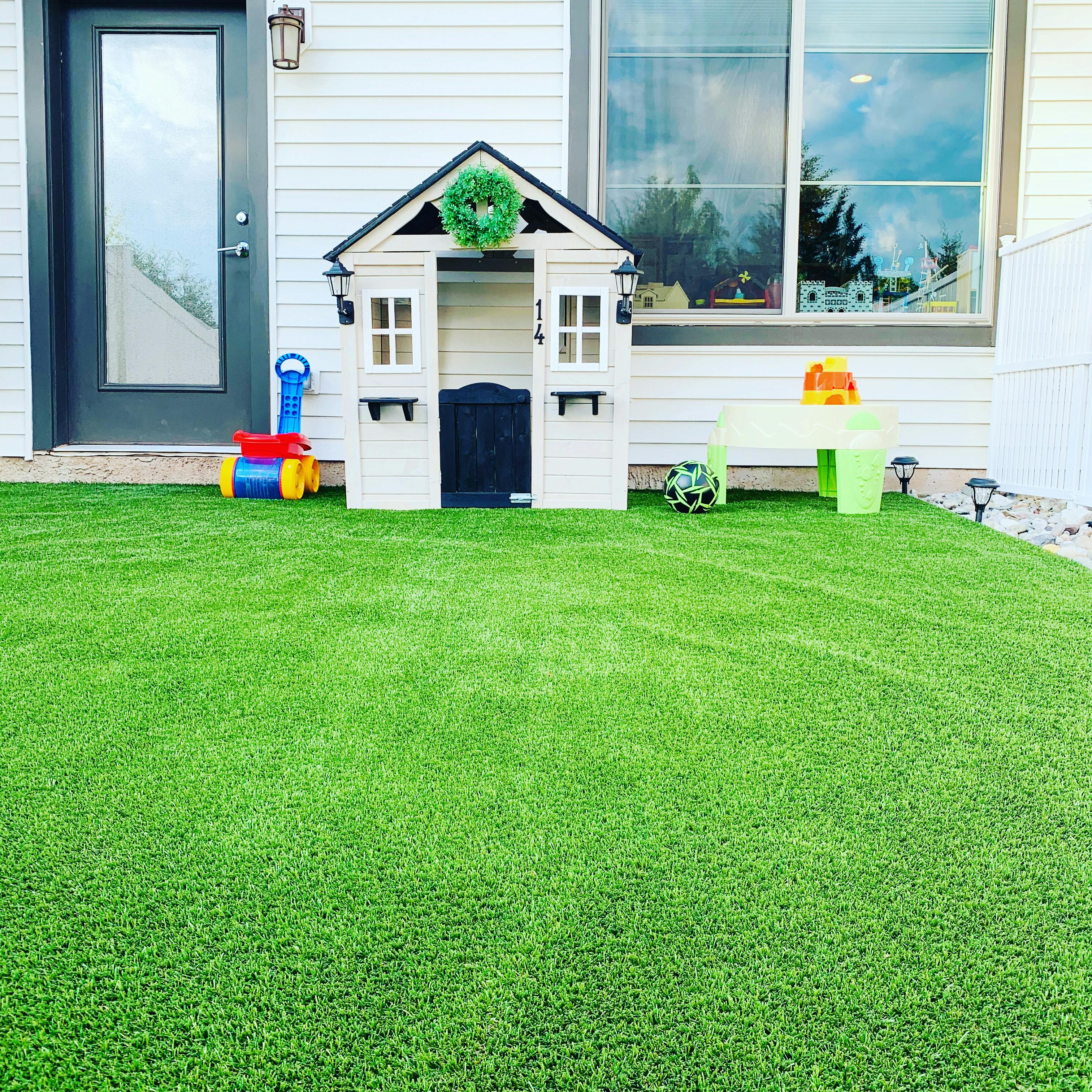 Playhouse and toys on artificial turf