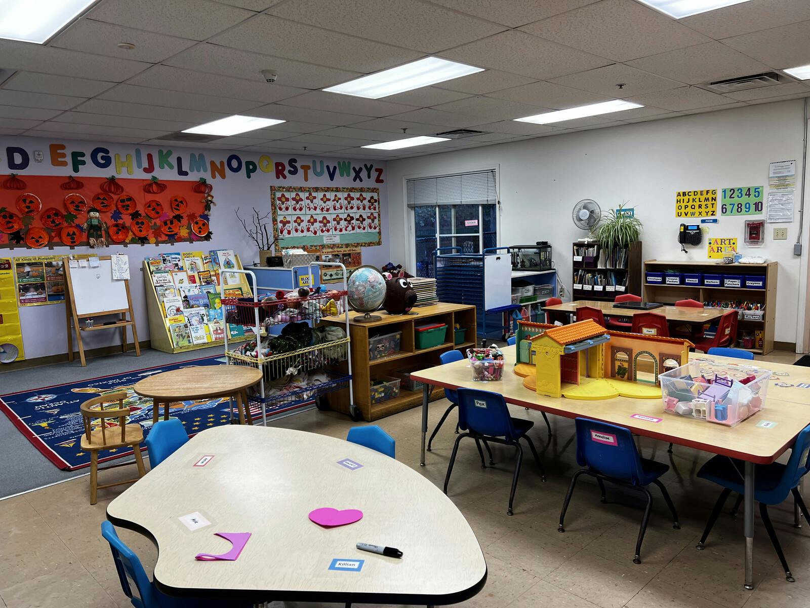 Classroom with tables, chairs, and learning materials
