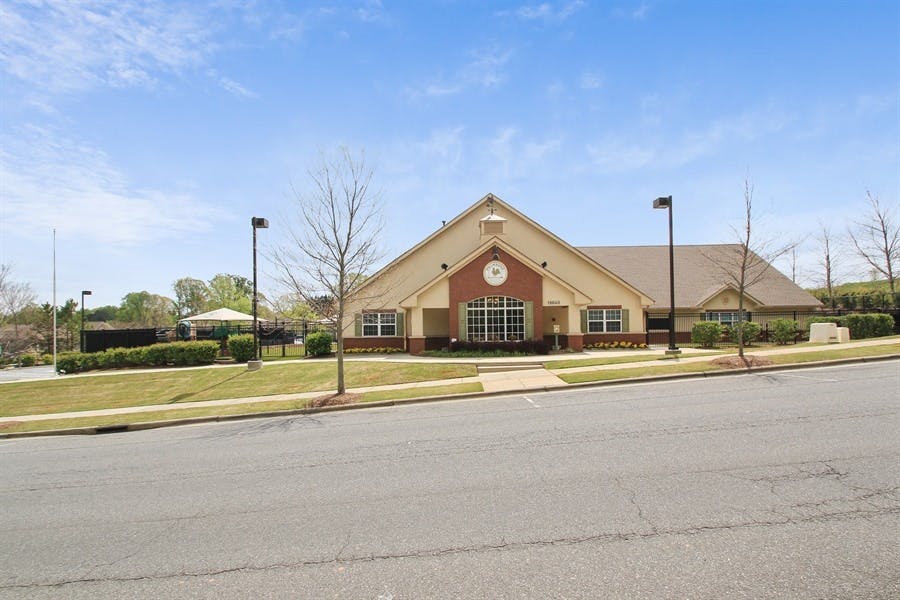 Building with a gabled roof and brick facade
