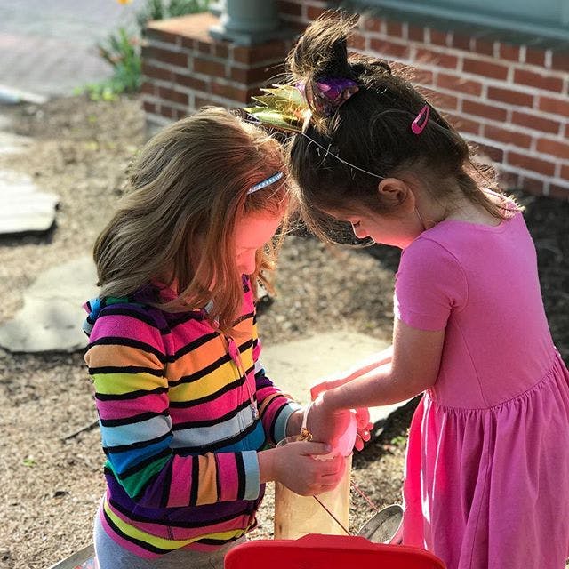 Two children playing outdoors