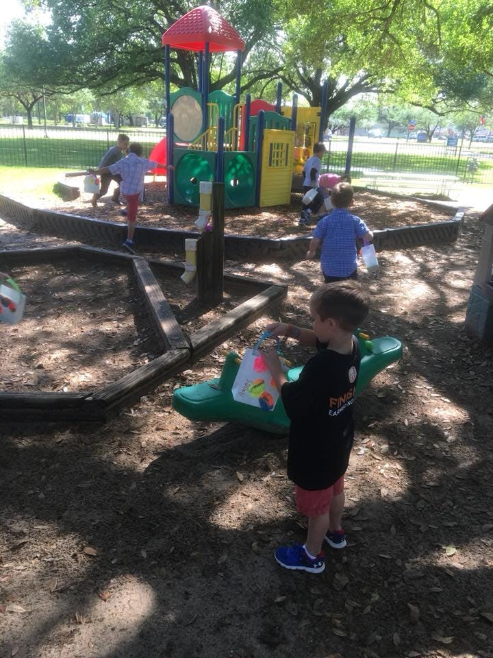 Children playing in a sandbox at a playground