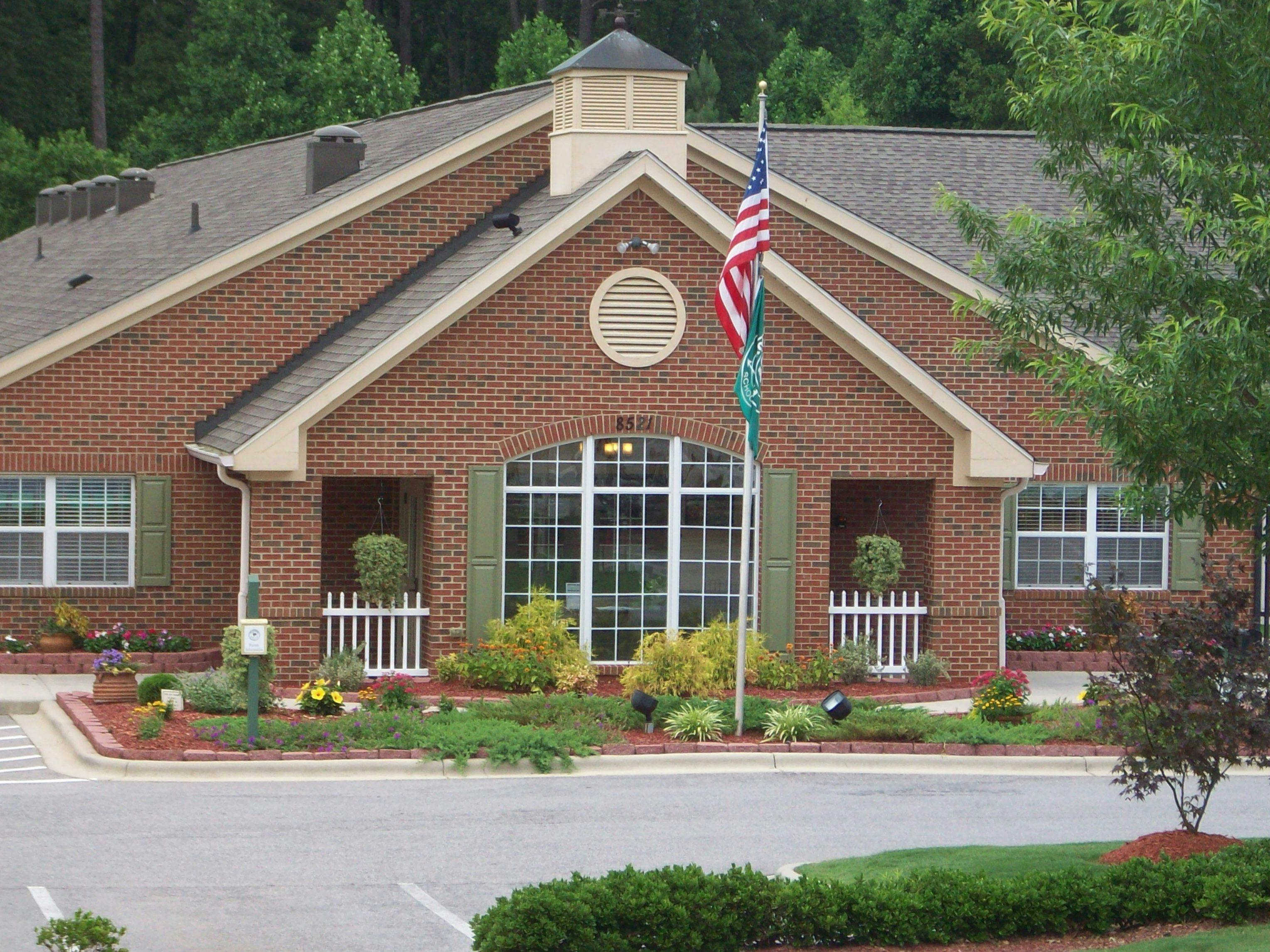 Brick building with a flagpole displaying an American flag