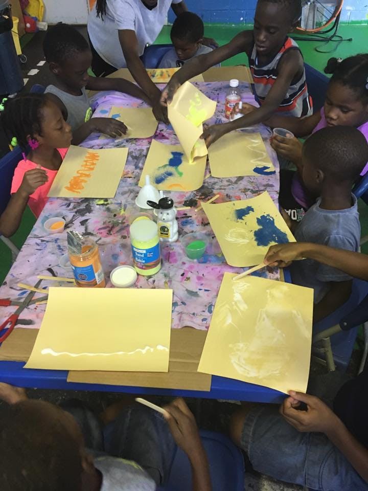 Children doing arts and crafts at a table