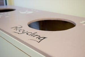 Recycling bin with a circular opening